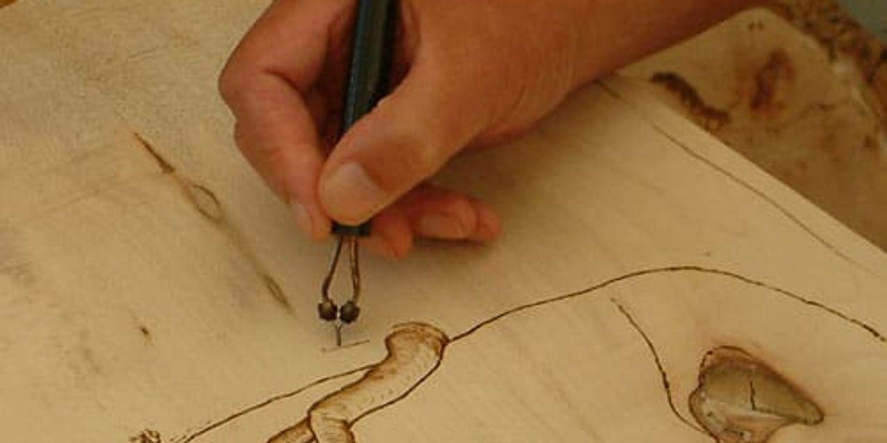 Hand drawing with hot iron